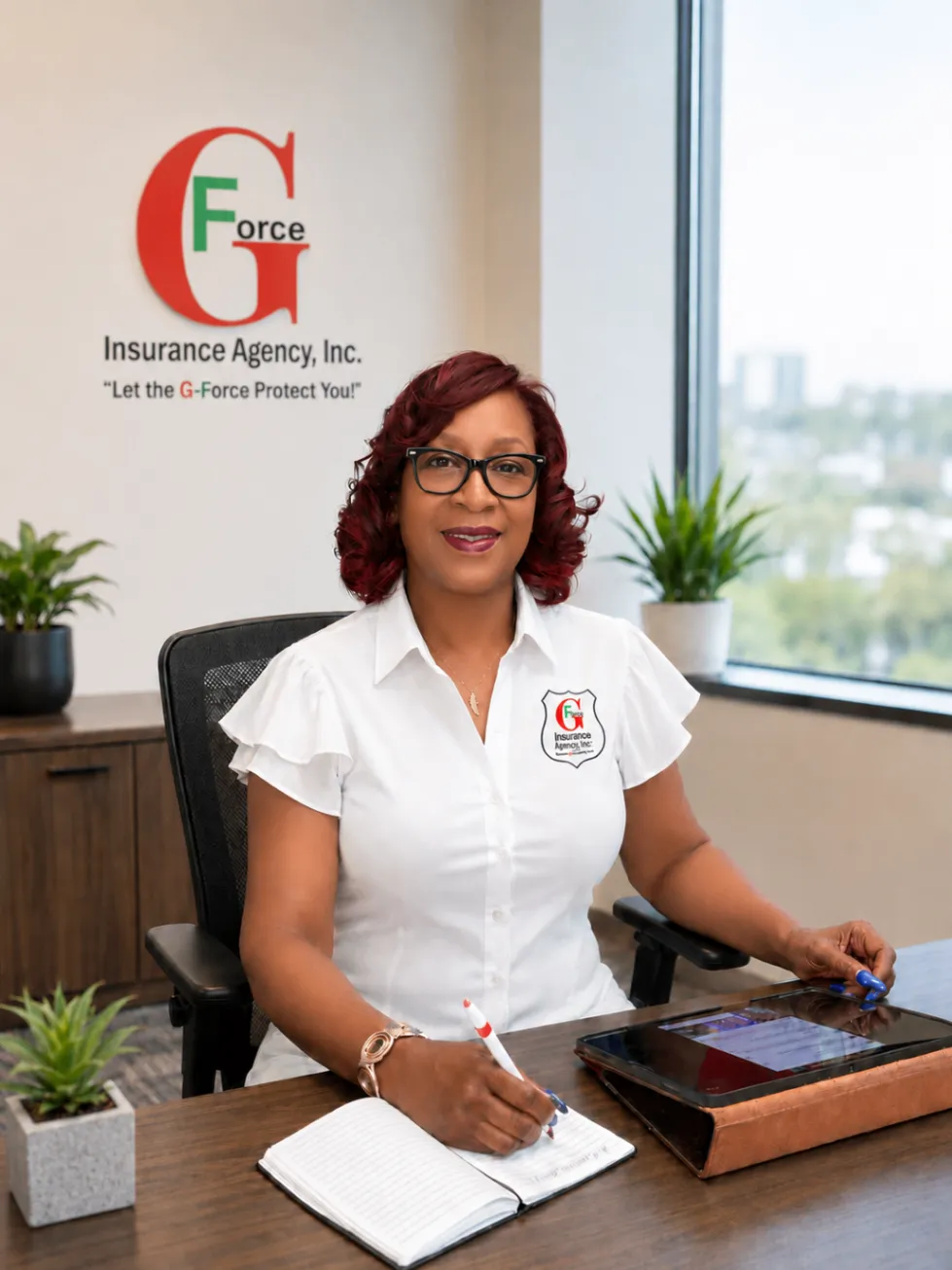 G-Force Insurance Agency representative in front of the G-Force wall logo